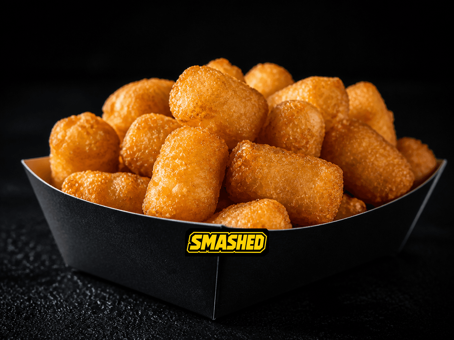 Regular crispy tots in a black SMASHED box