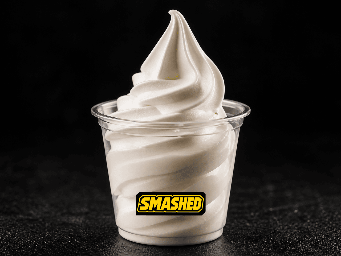 Vanilla soft serve in a branded clear cup